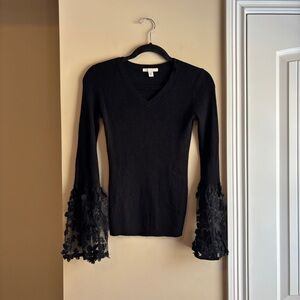 Knit top with sheer sleeve details